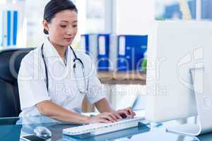 Doctor typing on keyboard