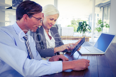 Business people working on tablet computer