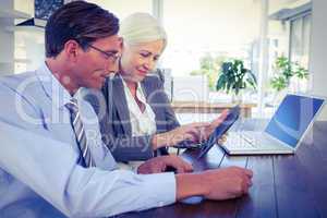 Business people working on tablet computer