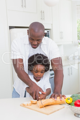 Little boy cooking with his father