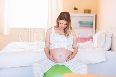 Pregnant woman keeping in shape