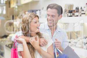 A happy couple with shopping bags