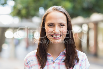 Portrait of pretty brunette smiling at camera