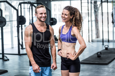 A muscular couple discussing together A muscular couple discussing together
