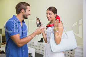 Young couple deciding on which shoe to choose