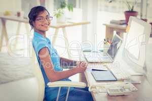 Casual designer working at her desk