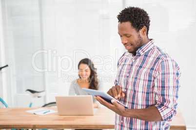 Young businessman holding a tablet