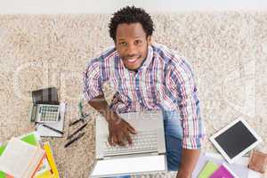 Young businessman types on the laptop