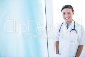 Confident female doctor smiling at camera