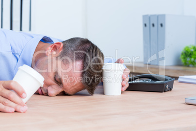 Businessman sleeping on his desk