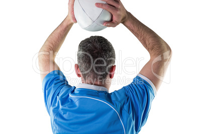 Rugby player about to throw a rugby ball