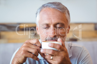 Man sitting in cafe having coffee