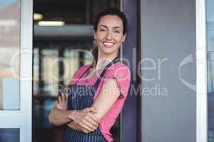 Pretty waitress leaning on the wall