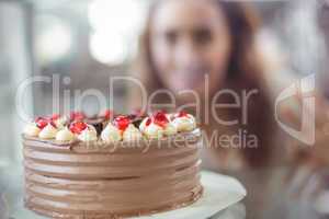 Display case of chocolate cake