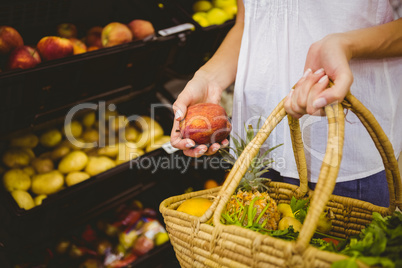 Smiling pretty blonde woman buying products