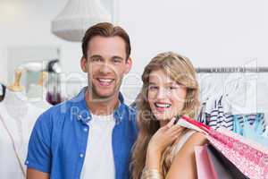 Portrait of a happy couple with shopping bags