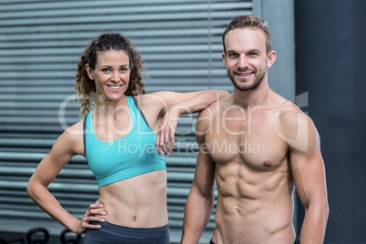 Muscular couple looking at the camera