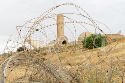 Monument to the Negev Brigade in Beer Sheva, Israel, seen through the barbed wire