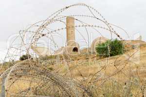 Monument to the Negev Brigade in Beer Sheva, Israel, seen through the barbed wire