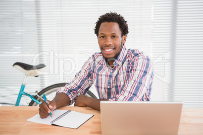 Young businessman smiling at the camera