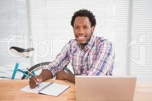 Young businessman smiling at the camera