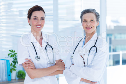 Portrait of smiling medical colleagues with arms crossed