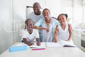 Portrait of a happy family looking at the camera