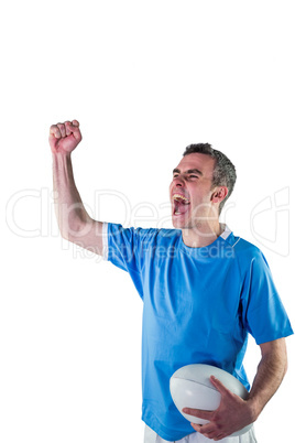 A rugby player gesturing victory A rugby player gesturing victory