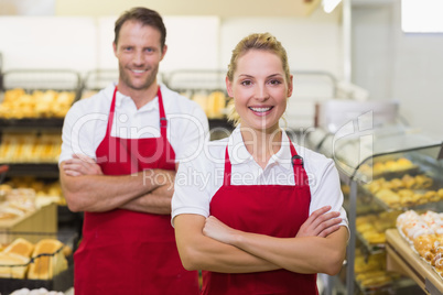 Portrait of a smiling bakers with arms crossed