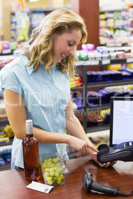 Woman at cash register paying with credit card