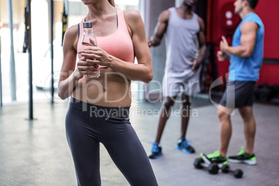 Young smiling Woman holding a bottle of water