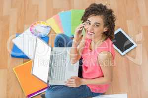 Young creative businesswoman working on laptop