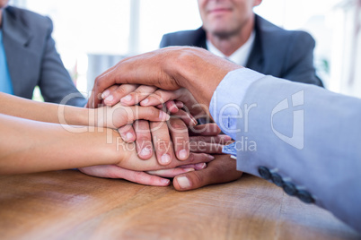 Business people joining hands together