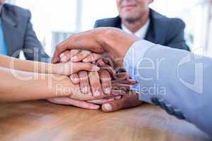 Business people joining hands together