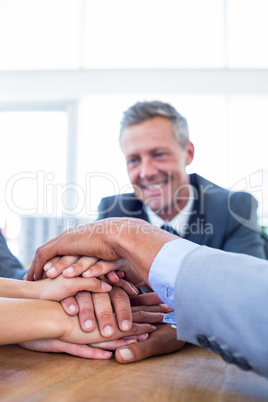 Business people joining hands together