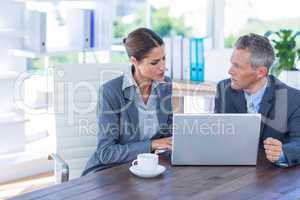 Business people working on laptop computer