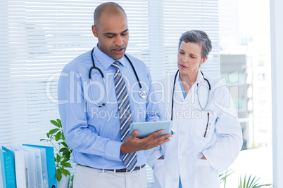 Medical colleagues working with tablet computer