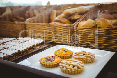 Close up of basket with fresh bread and pastry