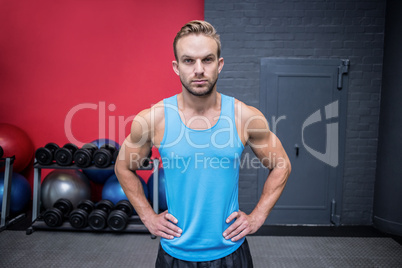 Muscular man with hands on the hips