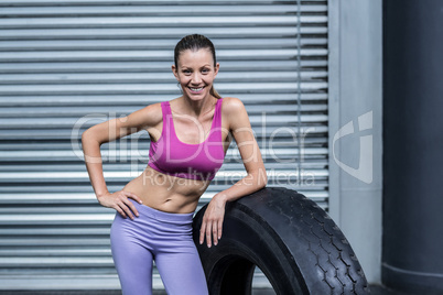 Smiling muscular woman looking at the camera