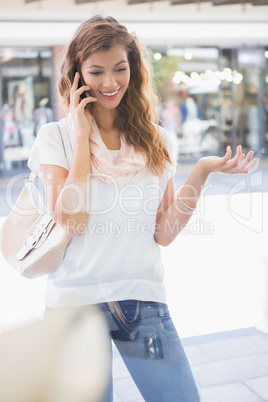 Smiling woman calling with smartphone