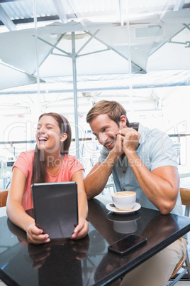 Young happy couple laughing