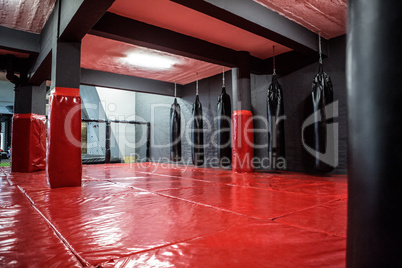 Red boxing area with punching bags