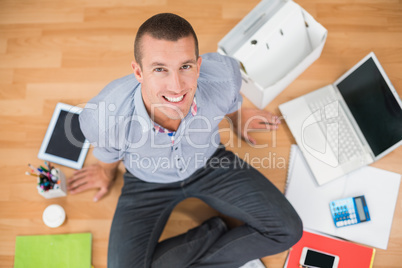 Young creative businessman looking at camera