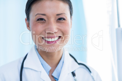 Confident female doctor smiling at camera Confident female doctor smiling at camera