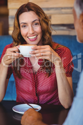 Cute couple having coffee together