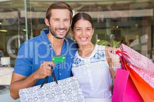 Young happy couple looking at camera