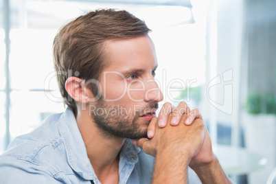 Young thoughtful man looking in the distance