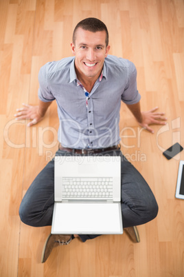 Young creative businessman looking at camera