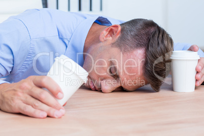 Businessman sleeping on his desk